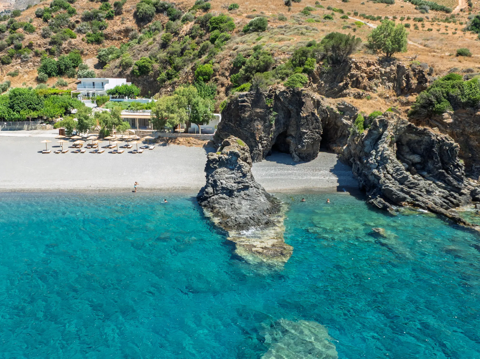 The house, Korakas pebbles, sea stack and clear Libyan Sea
