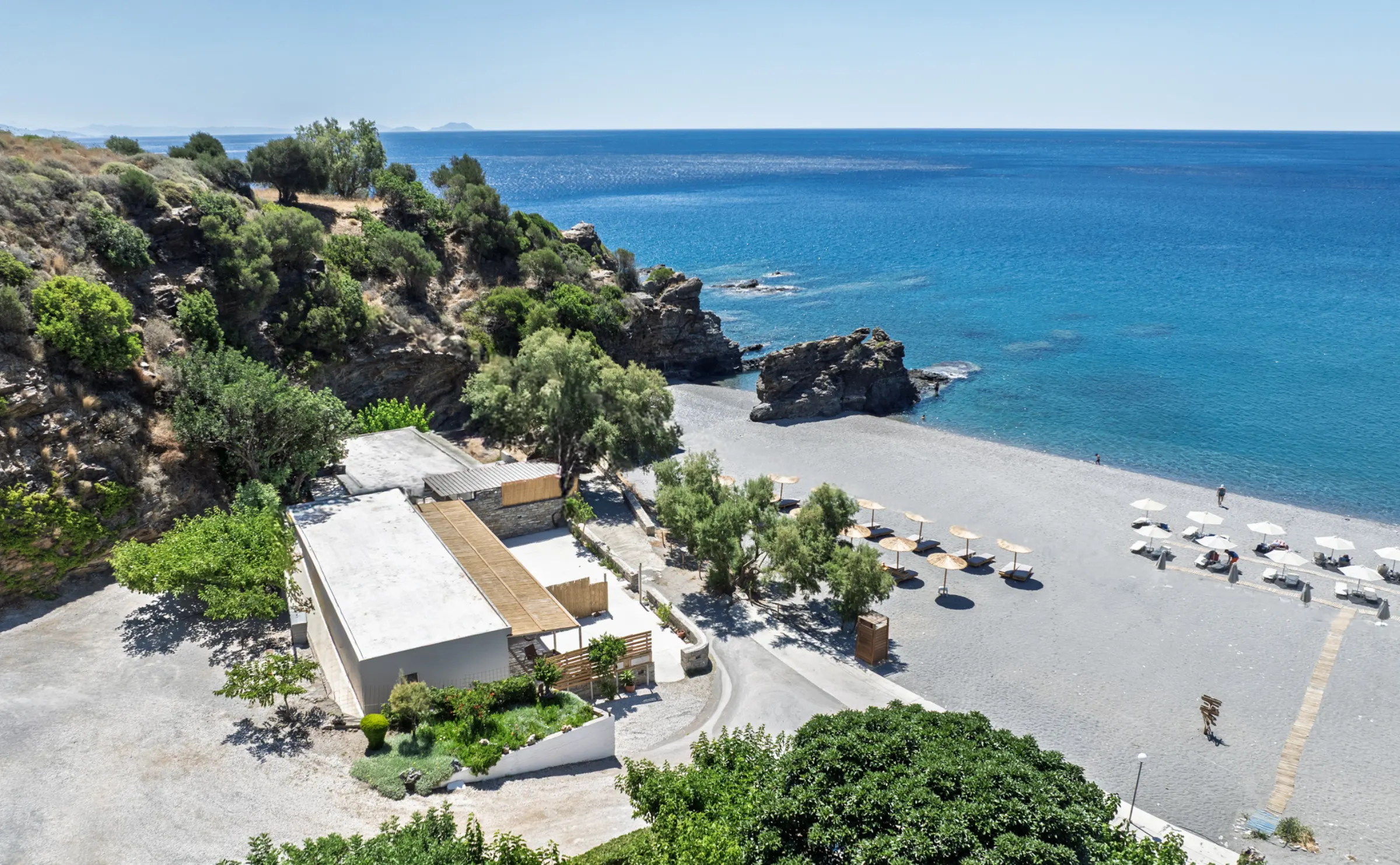 Spilies at the eastern edge of Korakas beach, with the rocky point and Libyan Sea beyond